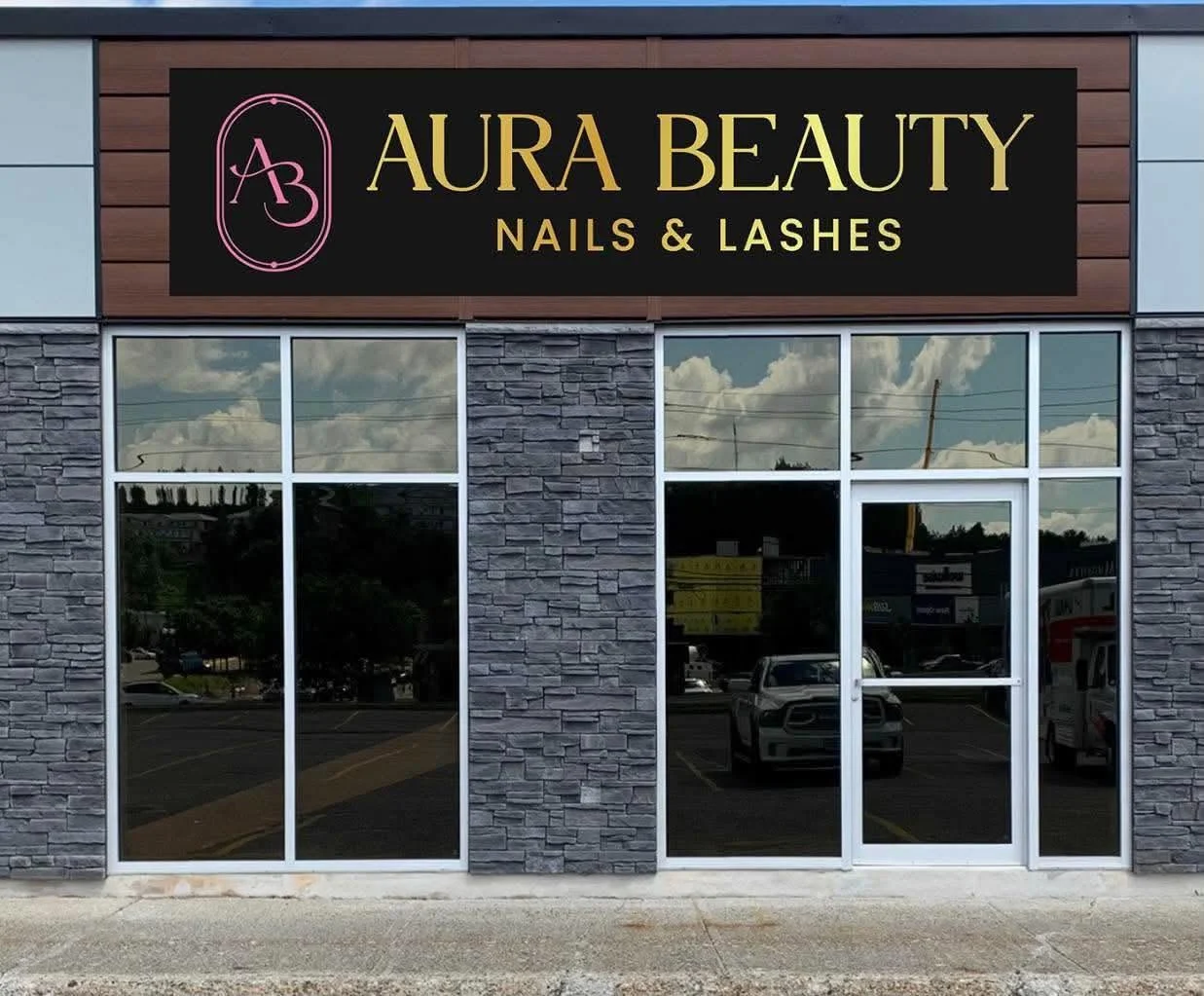 Aura Beauty Nails & Lashes storefront with its black, gold, and pink sign at 444 Barry Downe Road in Greater Sudbury